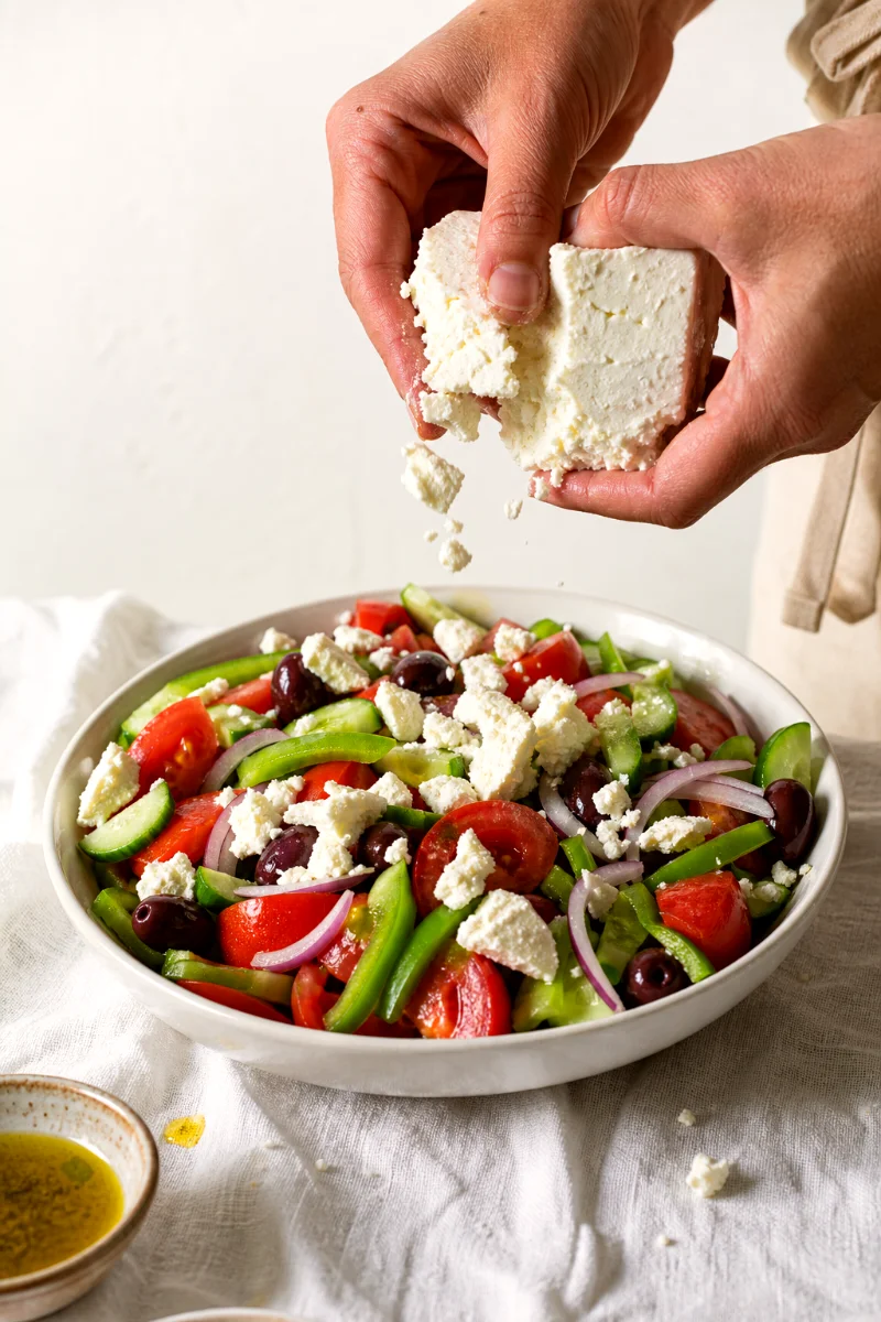 crumbling-feta-over-greek-salad