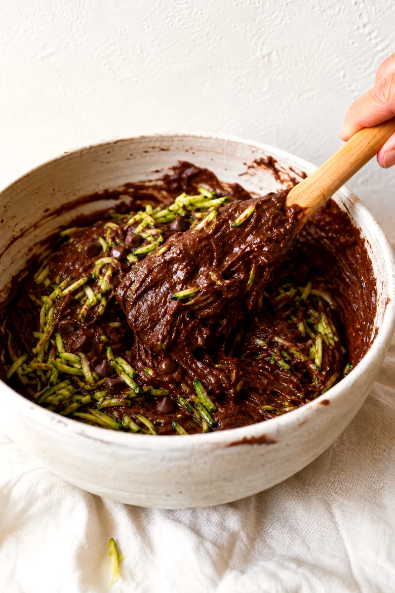 folding-zucchini-into-chocolate-muffin-batter
