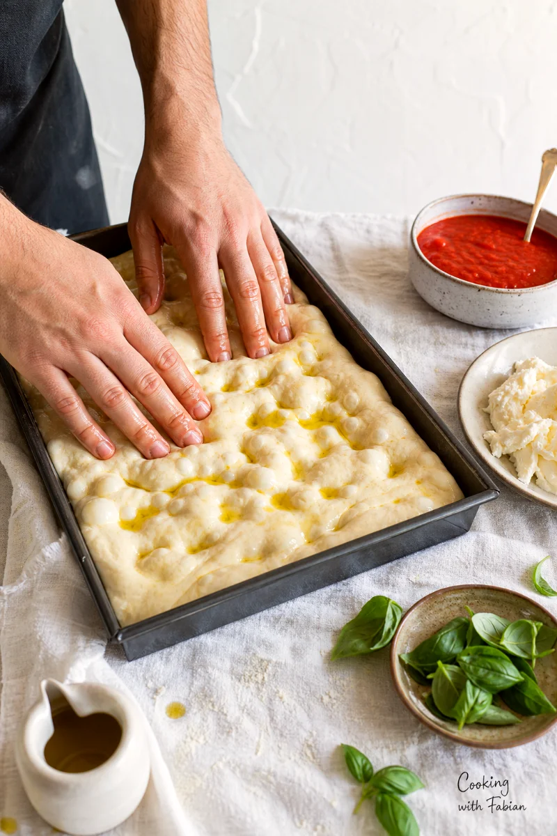 dimpling-no-knead-focaccia-dough