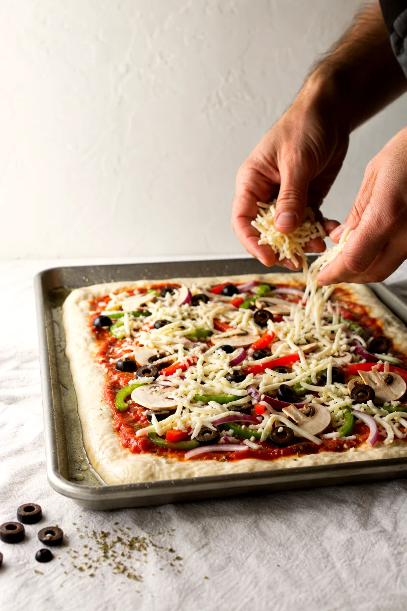 loaded-veggie-sheet-pan-pizza-assembly