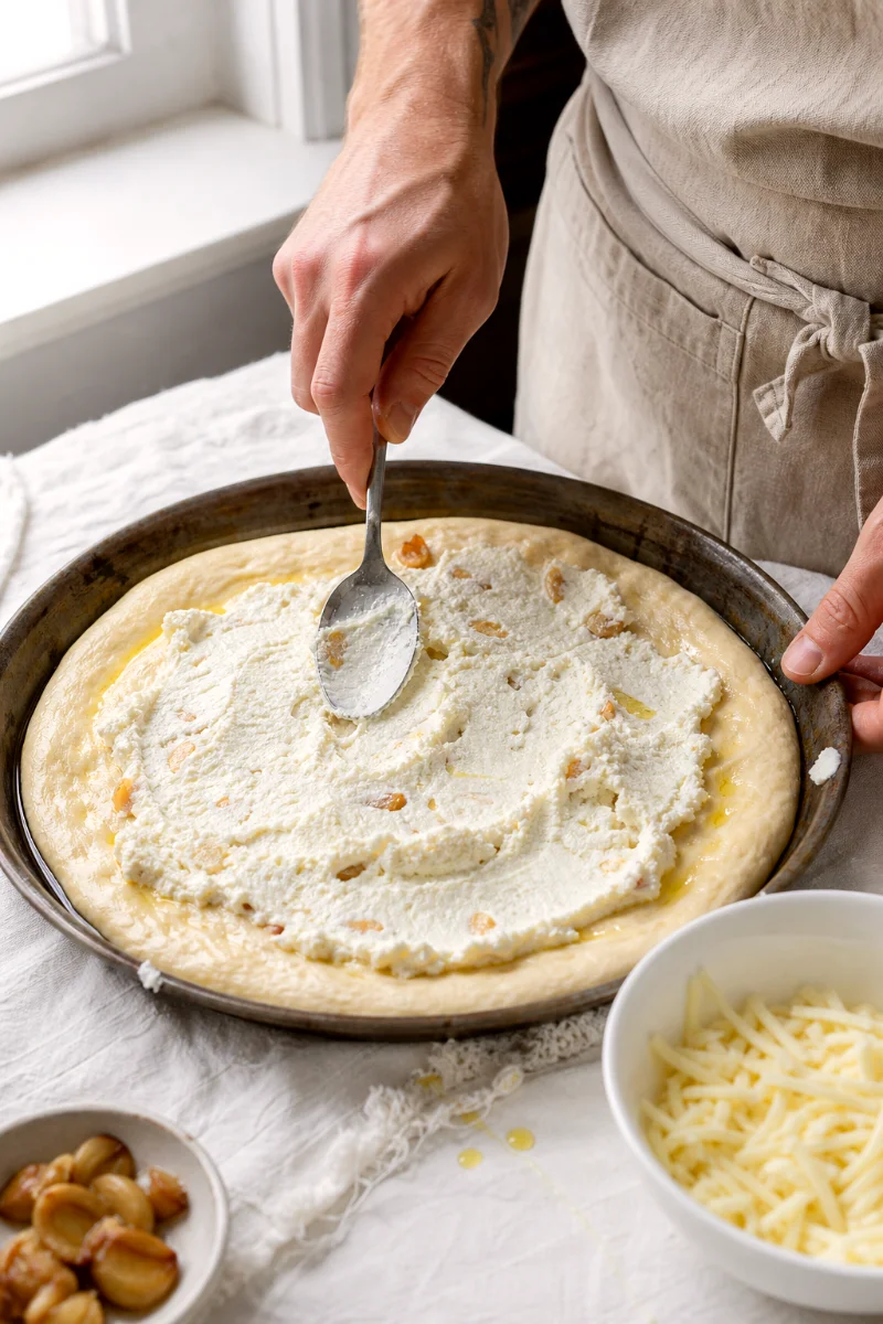 spreading-ricotta-garlic-base-pan-pizza