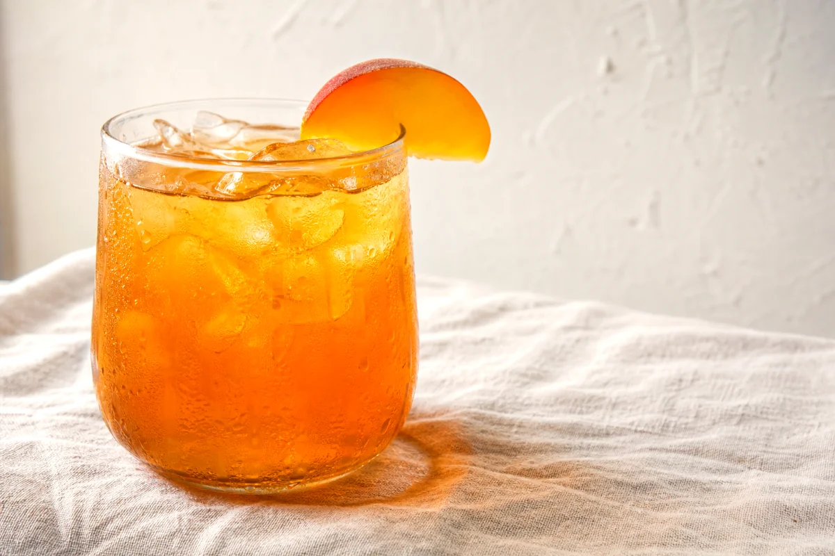 homemade-peach-iced-tea-glass-with-ice
